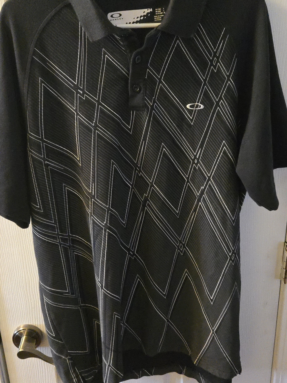 Oakley Black Polo with Silver Geometric Lines